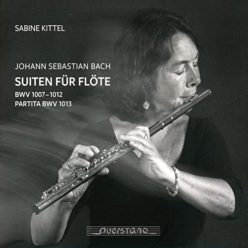 Flutist Sabine Kittel holding a silver flute, album cover for Bach suites.