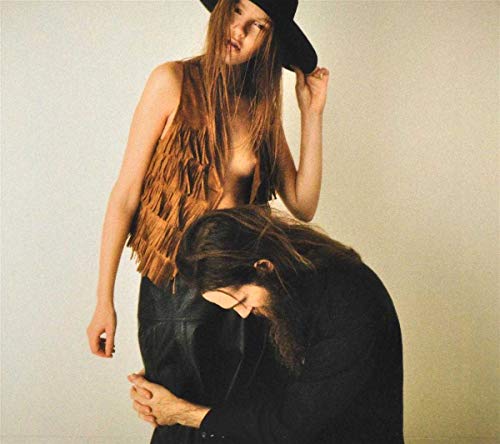 CD cover featuring two people with long hair in muted tones.