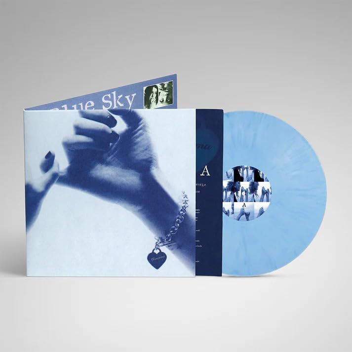 Sky blue marbled vinyl record with album cover and inner sleeve.