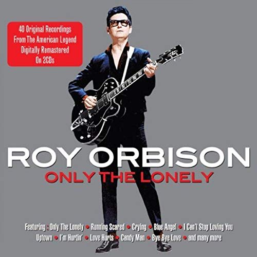 Roy Orbison wearing sunglasses and holding a guitar on this music album cover.