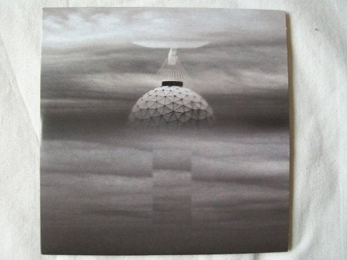 Black and white album cover featuring a geometric dome in fog.