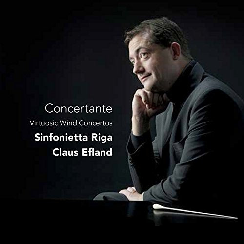 CD cover featuring a portrait of conductor Claus Eland in black attire.