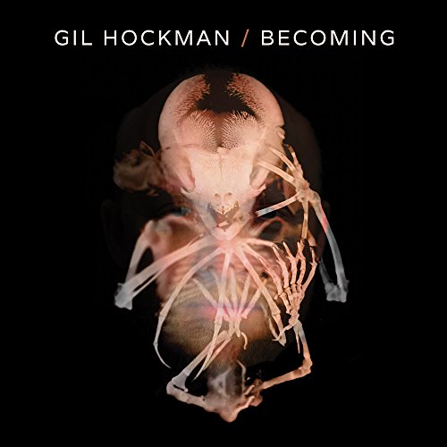 CD cover: ghostly image of a human head with skeletal overlay.