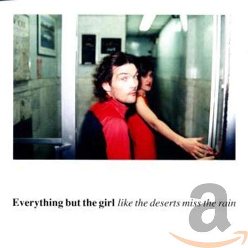 CD cover with a man and woman in a hallway, album title below.