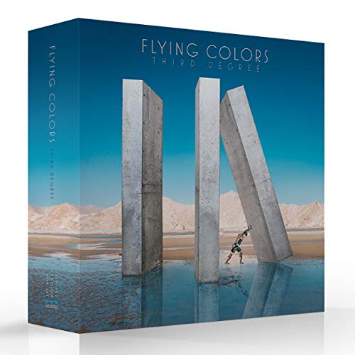 A person pushes a large concrete pillar in a desert landscape on this box set.