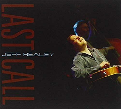 Jeff Healey playing guitar with his head tilted back on a dark album cover.