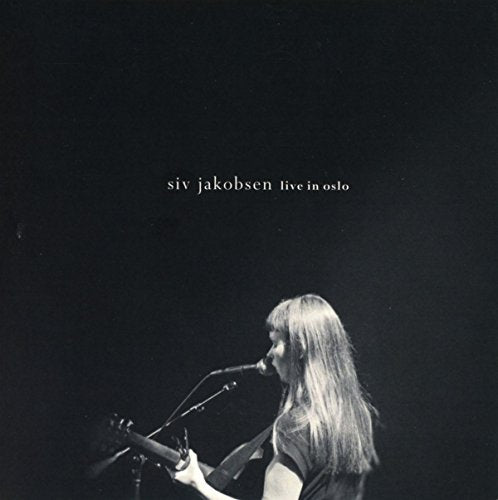 CD cover: Siv Jakobsen playing guitar, side profile, dark background.