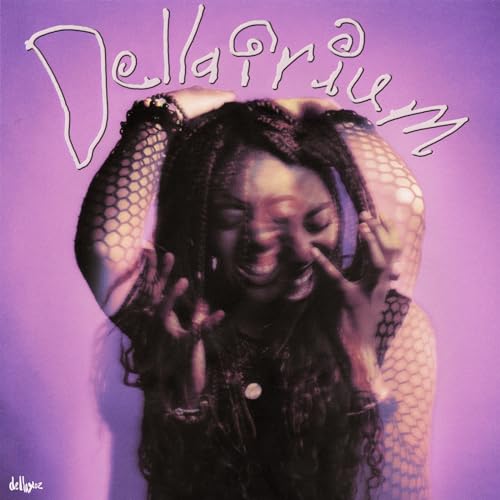 Woman with dark hair and fishnet sleeves against a purple background.