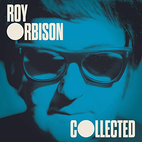 Close-up portrait of Roy Orbison wearing glasses, tinted in blue with white text overlay.