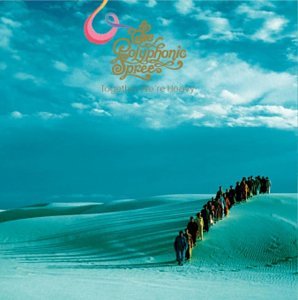 CD cover: a long line of people walking across sand dunes.