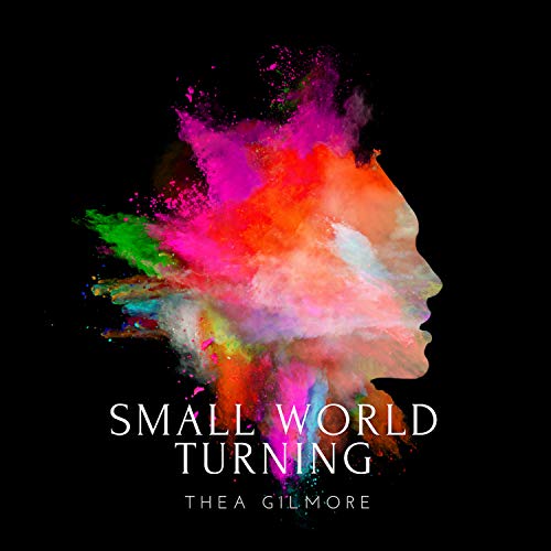 Album cover: colorful, exploding paint forming a woman’s profile.