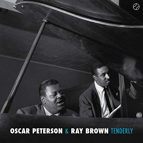 Black and white photo of Oscar Peterson and Ray Brown with a piano.