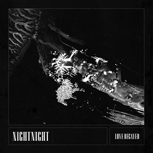 Black and white album cover with abstract, decaying organic shapes.