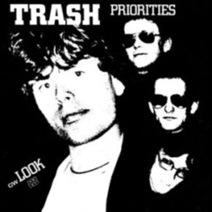Black and white album cover featuring three people wearing sunglasses.