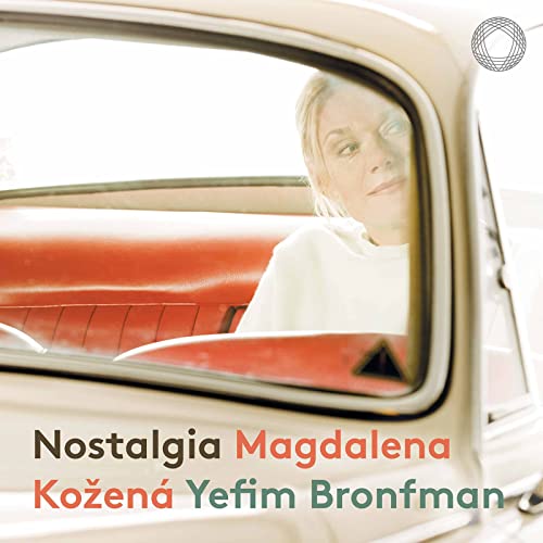 CD cover: woman’s face viewed through a car’s rear window.