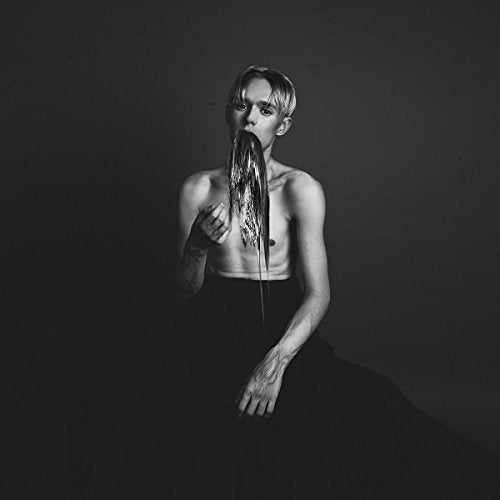 Black and white album cover featuring a shirtless person with long hair.