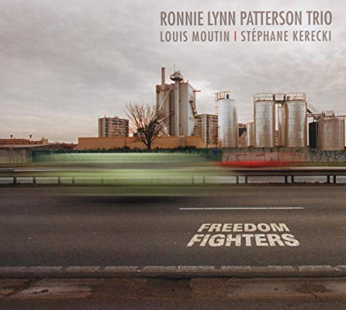CD cover for "Freedom Fighters" featuring industrial buildings and text.