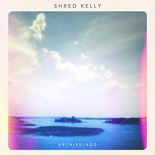 CD cover for Shred Kelly’s “Archipelago” featuring a seascape and cloudy sky.