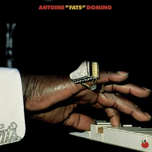 Antoine "Fats" Domino album cover featuring a hand with rings at a piano.