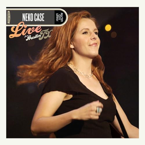 Neko Case portrait on album cover, with pink and black text.