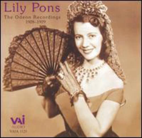 Lily Pons in a lace dress holding a fan, vintage portrait.