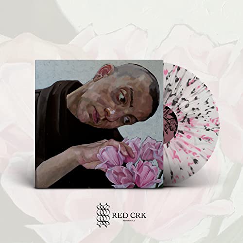 Vinyl record with painted cover featuring a person and pink flowers.
