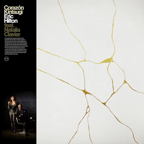 Vinyl album cover: black side, white cracked surface with gold repairs.
