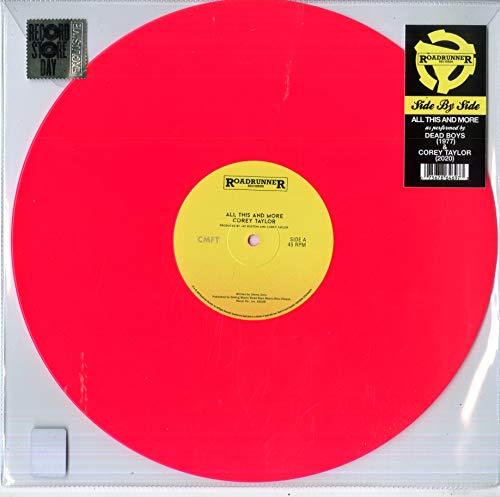Pink vinyl record with black and gold labels and stickers.
