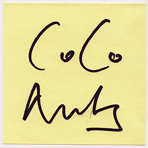Handwritten text reading Coconuts in black ink on a square yellow sticky note.