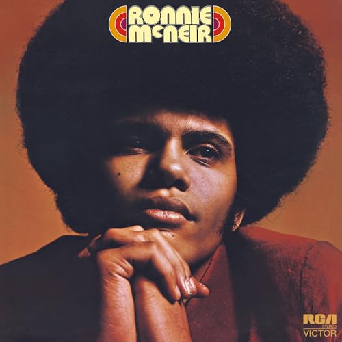 Album cover featuring Ronnie Mcneir with a large afro, looking downward.