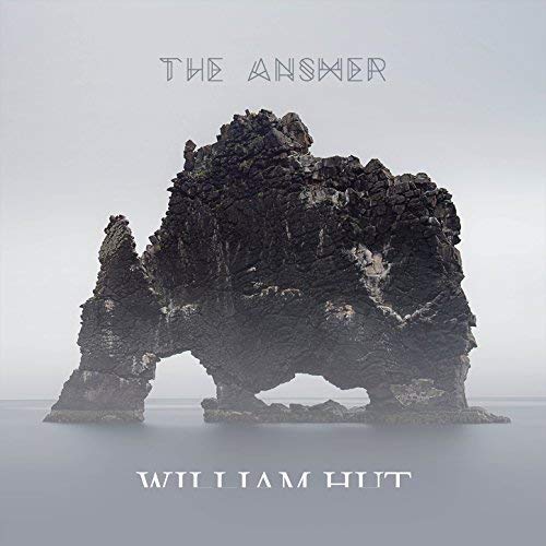 CD cover featuring a dark, rocky coastal formation against a grey sky.