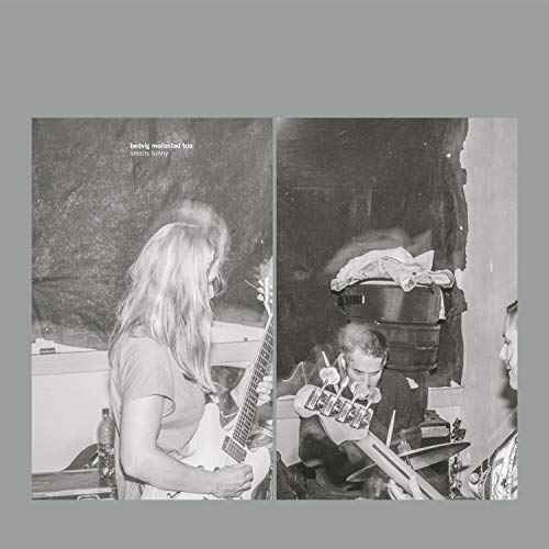 Black and white album cover featuring musicians playing instruments.