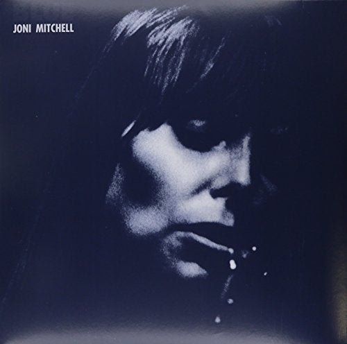 Joni Mitchell album cover: a dark, close-up portrait of the artist.