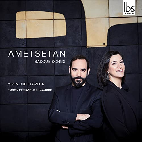 CD cover featuring two people and abstract geometric shapes.