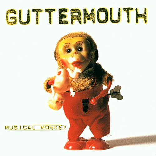 CD cover featuring a vintage wind-up monkey toy with a doll.