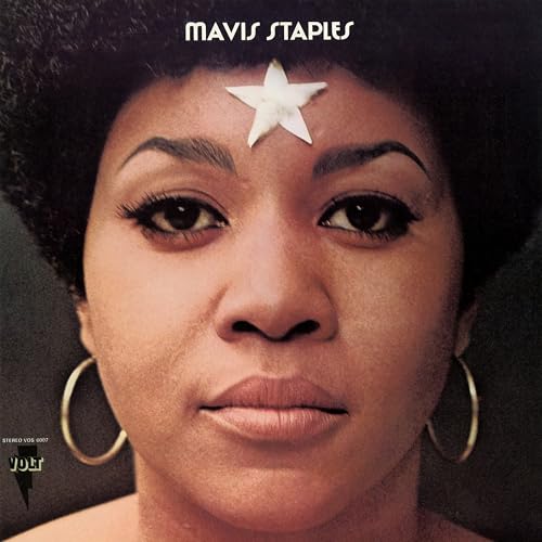 Close-up portrait of Mavis Staples with a white star on her forehead.
