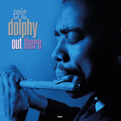 Eric Dolphy playing flute, album cover with blue tones and text.
