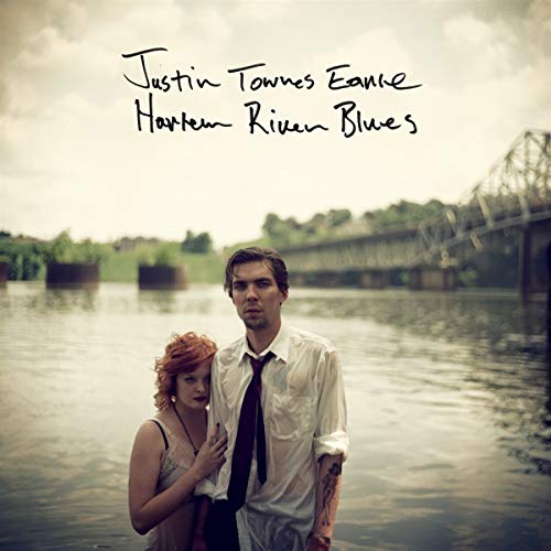 Album cover featuring a man and woman by a river and bridge.