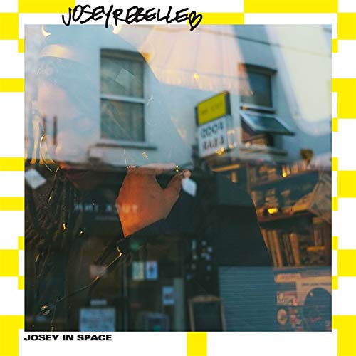 Album cover for Josey Rebelle’s “Josey in Space” with street scene.
