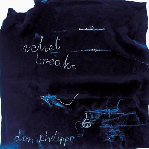 Dark blue velvet background with handwritten white text: "velvet breaks" and "don philippe".