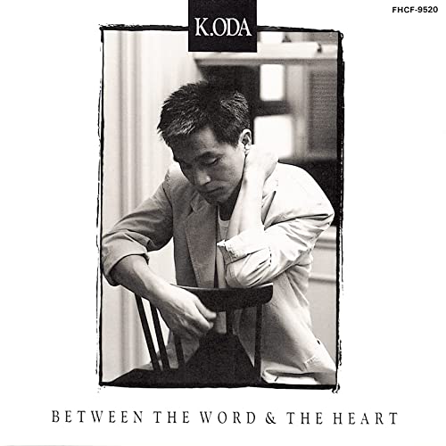 Black and white CD cover featuring a man seated and looking down.