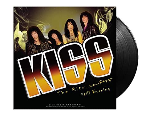 KISS album cover with band members and black vinyl record beside it.