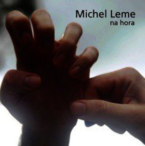 CD cover for Michel Leme's "Na Hora" featuring a blurred hand.