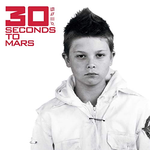 Black and white album cover featuring a young boy in a hoodie.