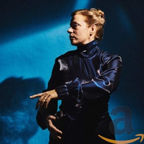 CD cover featuring a woman in dark clothing, side profile, blue tones.