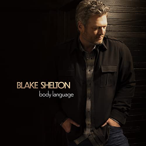 Blake Shelton album cover, dark background, portrait of singer in jacket.