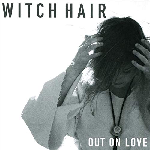 Black and white album cover featuring a person with long hair.