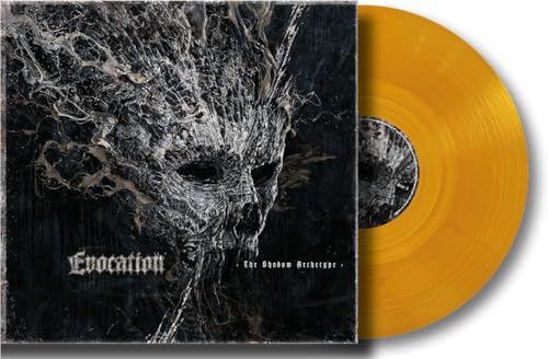 Vinyl record with orange disc and album cover featuring a dark, distorted face.