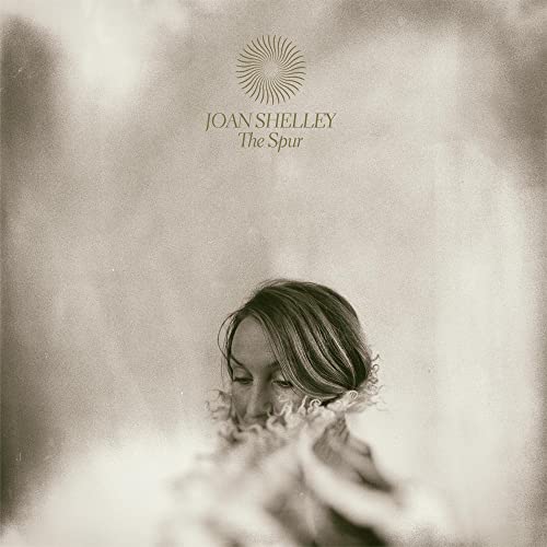Joan Shelley album cover, featuring a portrait of a woman in flowers.