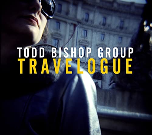 CD cover for Todd Bishop’s “Travelogue” featuring a blurred cityscape.